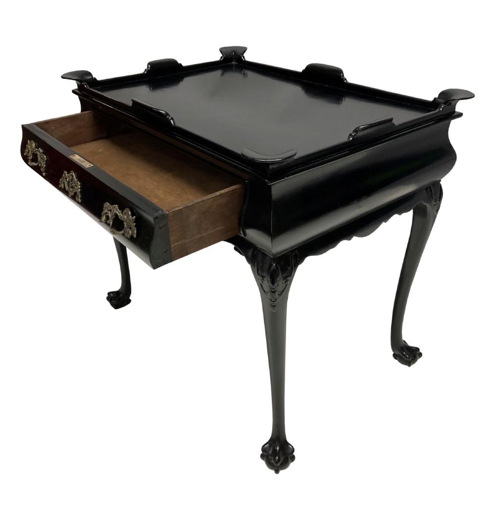 A black lacquered walnut silver table featuring a raised gallery top, a single drawer with brass handles, and cabriole legs with claw and ball feet. View II
