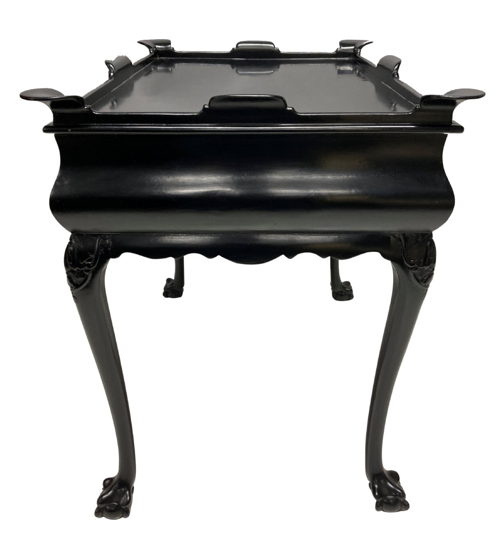 A black lacquered walnut silver table featuring a raised gallery top, a single drawer with brass handles, and cabriole legs with claw and ball feet. View IV