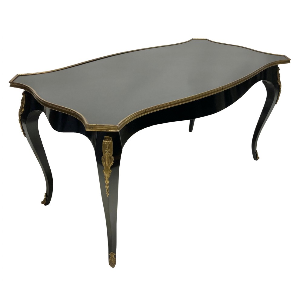 A low black lacquered Louis XV style occasional table with serpentine edges, gilt metal moulding, and cabriole legs with ormolu mounts. View III