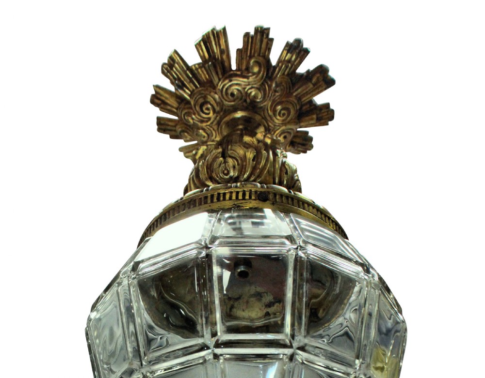 A French style gilt bronze and faceted clear glass hanging pendant lantern featuring leaf mounts and a crown canopy. View III