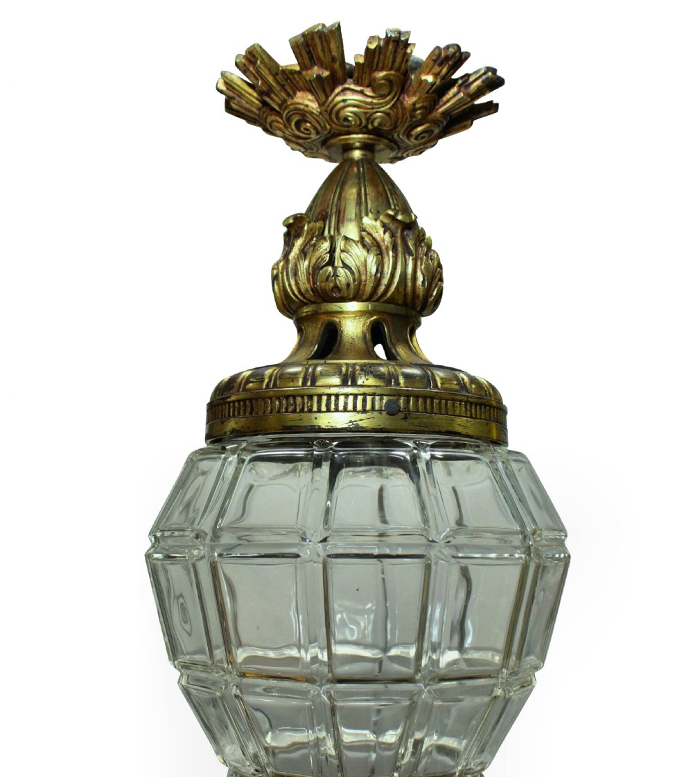 A French style gilt bronze and faceted clear glass hanging pendant lantern featuring leaf mounts and a crown canopy. View IV