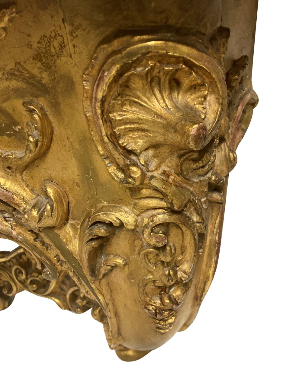 A 19th-century German Rococo Revival carved giltwood console table featuring an openwork scrolled apron and a serpentine white marble top. View II