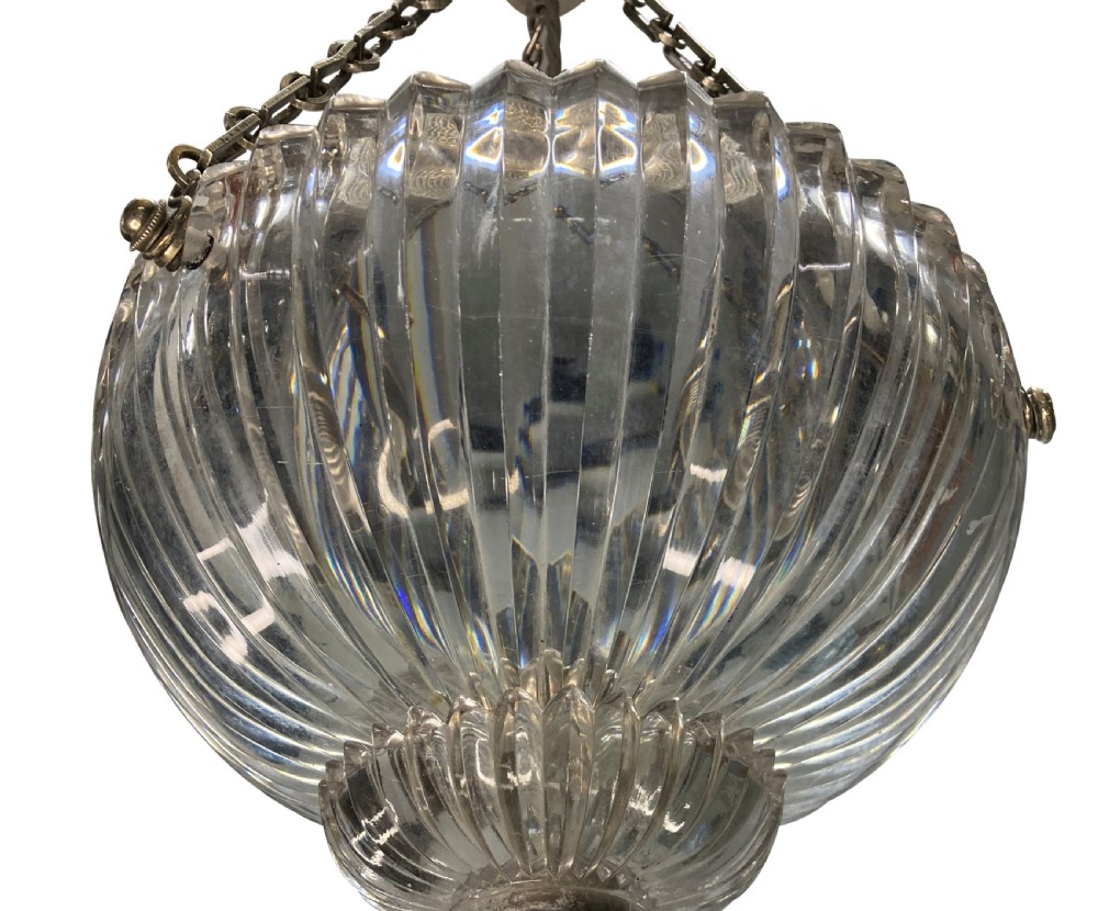 An Edwardian pendant light featuring a fluted clear cut glass bowl suspended by three silver-plated chains from a cast ceiling fitting. View VI