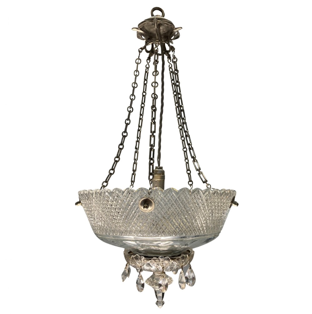 An Edwardian hanging dish light featuring diamond-cut clear glass suspended by metal chains with crystal drop prisms at the base.