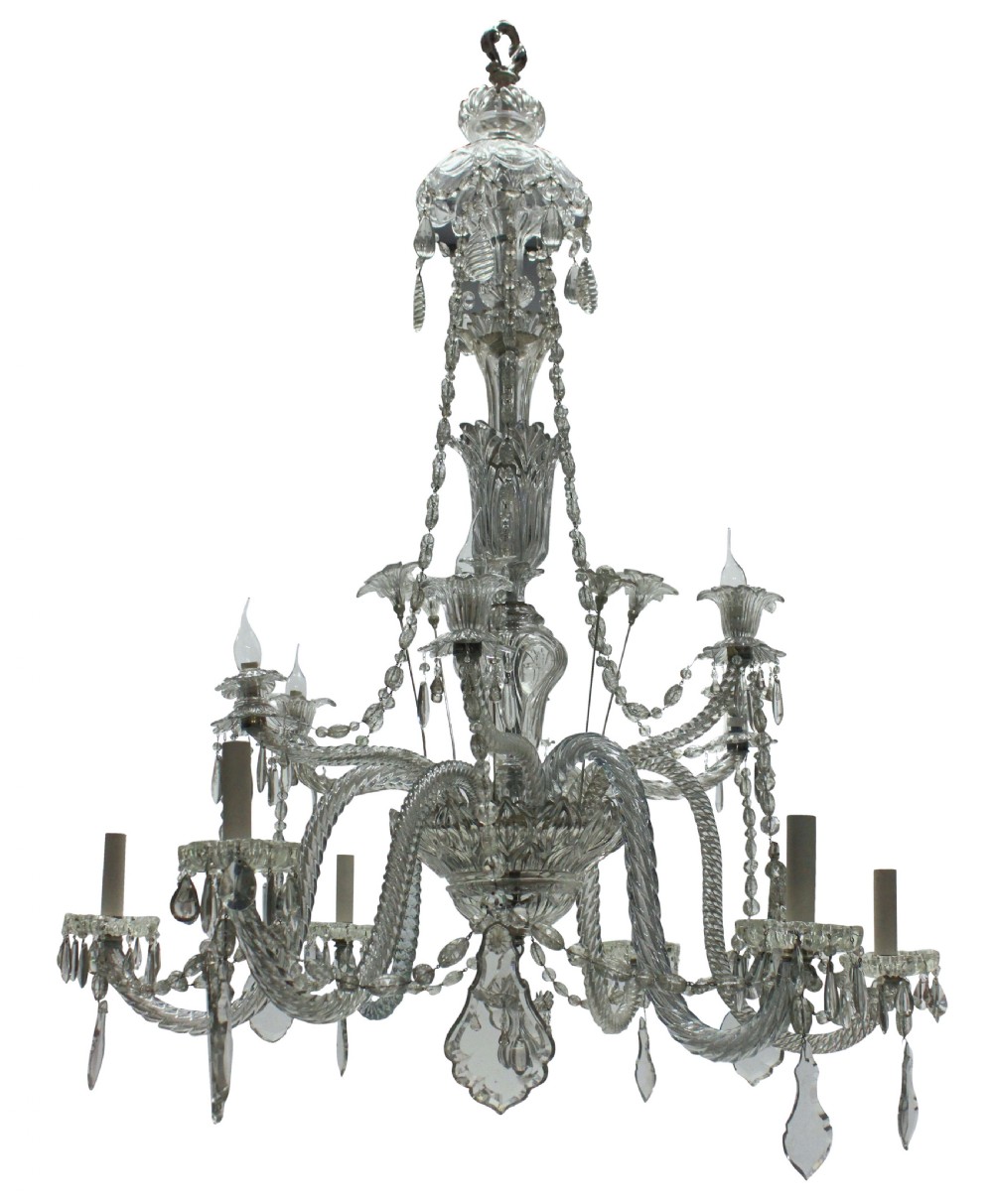 A large French twelve-arm clear cut-crystal chandelier featuring twisted glass arms, cascading crystal drops, and candle-style bulb holders.