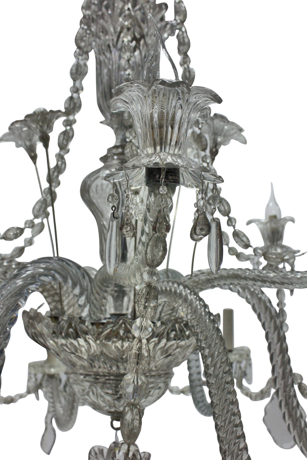 A large French twelve-arm clear cut-crystal chandelier featuring twisted glass arms, cascading crystal drops, and candle-style bulb holders. View VII