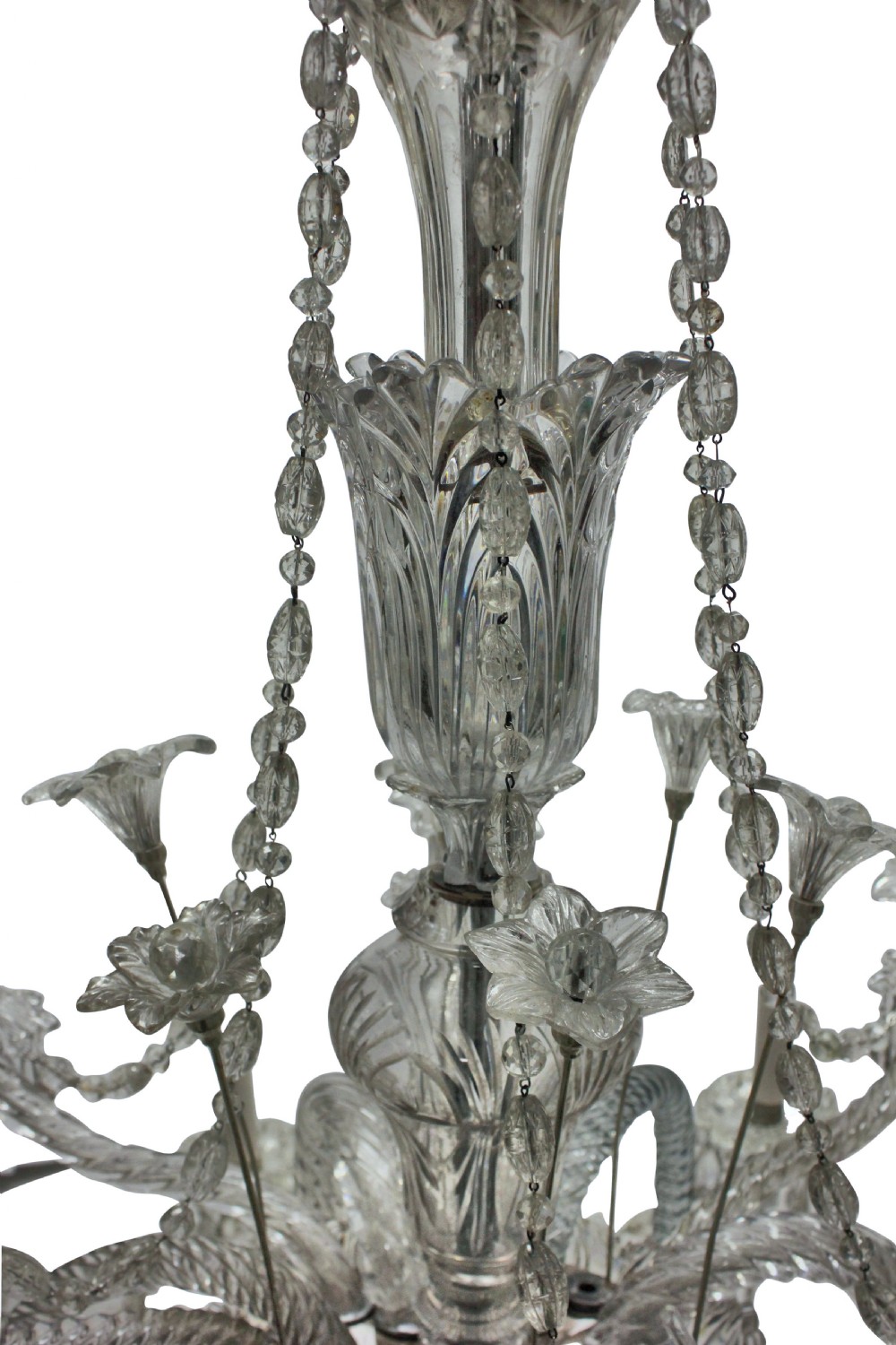 A large French twelve-arm clear cut-crystal chandelier featuring twisted glass arms, cascading crystal drops, and candle-style bulb holders. View IX