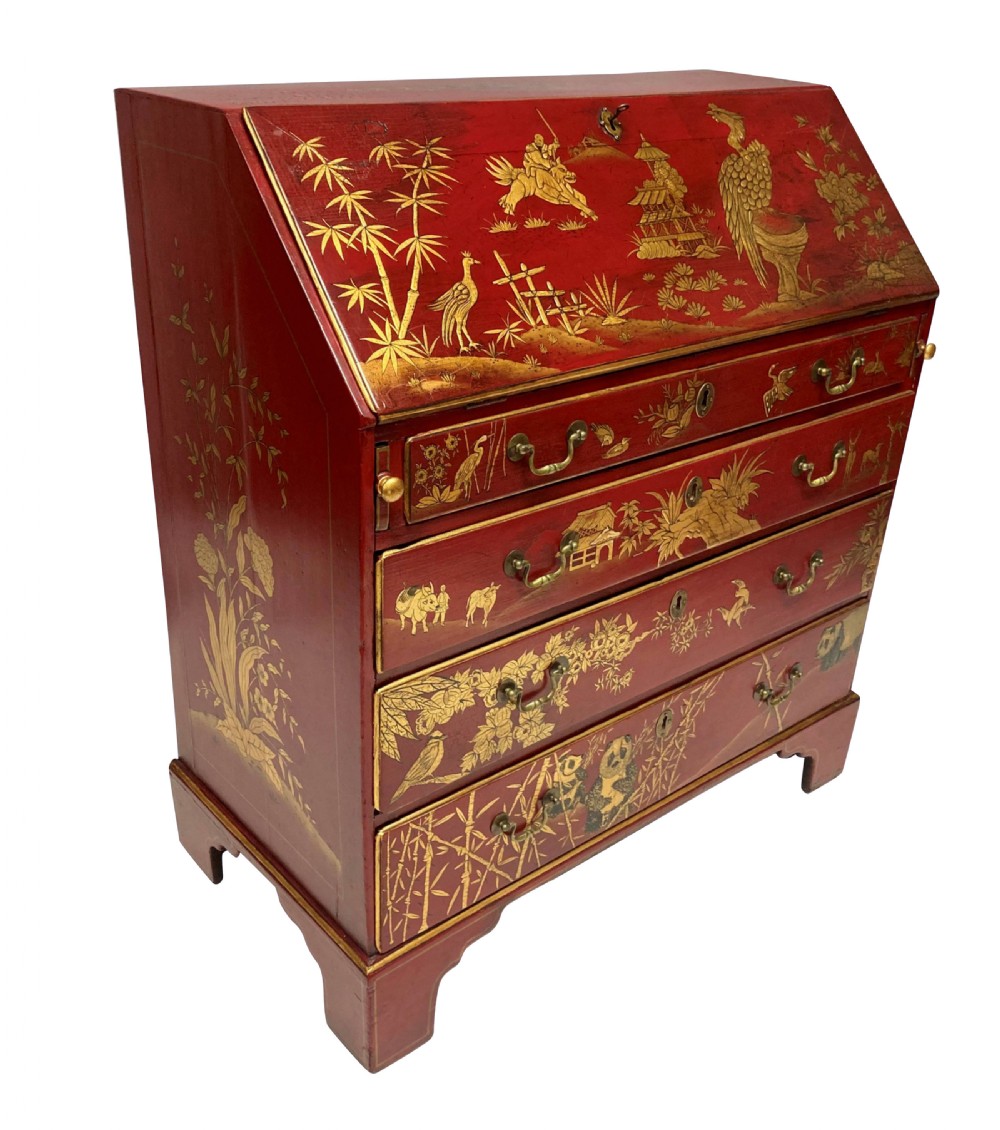 A George III scarlet japanned writing bureau featuring gilded Chinoiserie imagery, a slant front, and four long drawers on bracket feet. View IX
