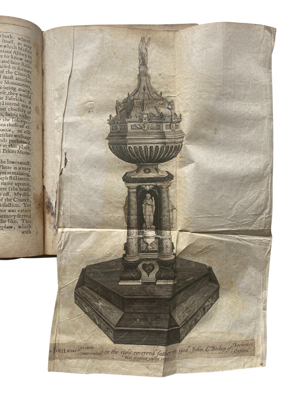 An open 17th-century printed book title page displaying black letterpress typography on cream rag paper titled The Antiquities of Canterbury by William Somner, dated 1640. View IV