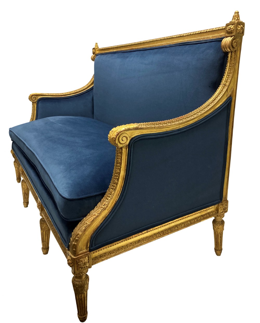 A French Louis XVI style settee featuring a carved giltwood frame with tapered fluted legs and blue velvet cushion upholstery. View III