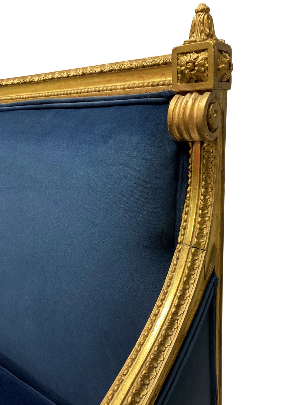 A French Louis XVI style settee featuring a carved giltwood frame with tapered fluted legs and blue velvet cushion upholstery. View IX