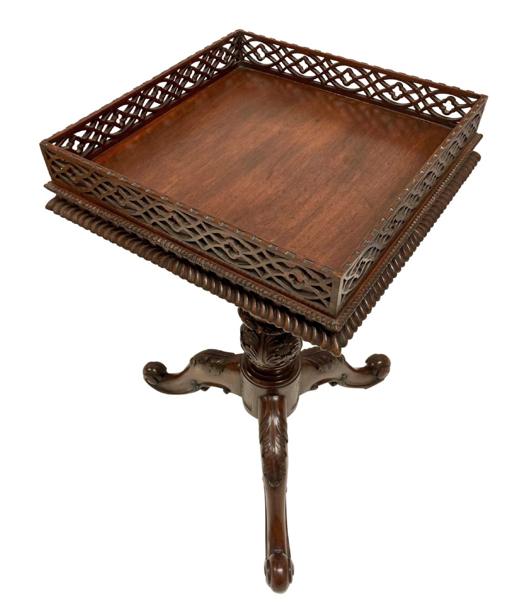 A pair of mahogany wine tables with square pierced fretwork galleries, carved central pedestals, and carved tripod cabriole legs. View III
