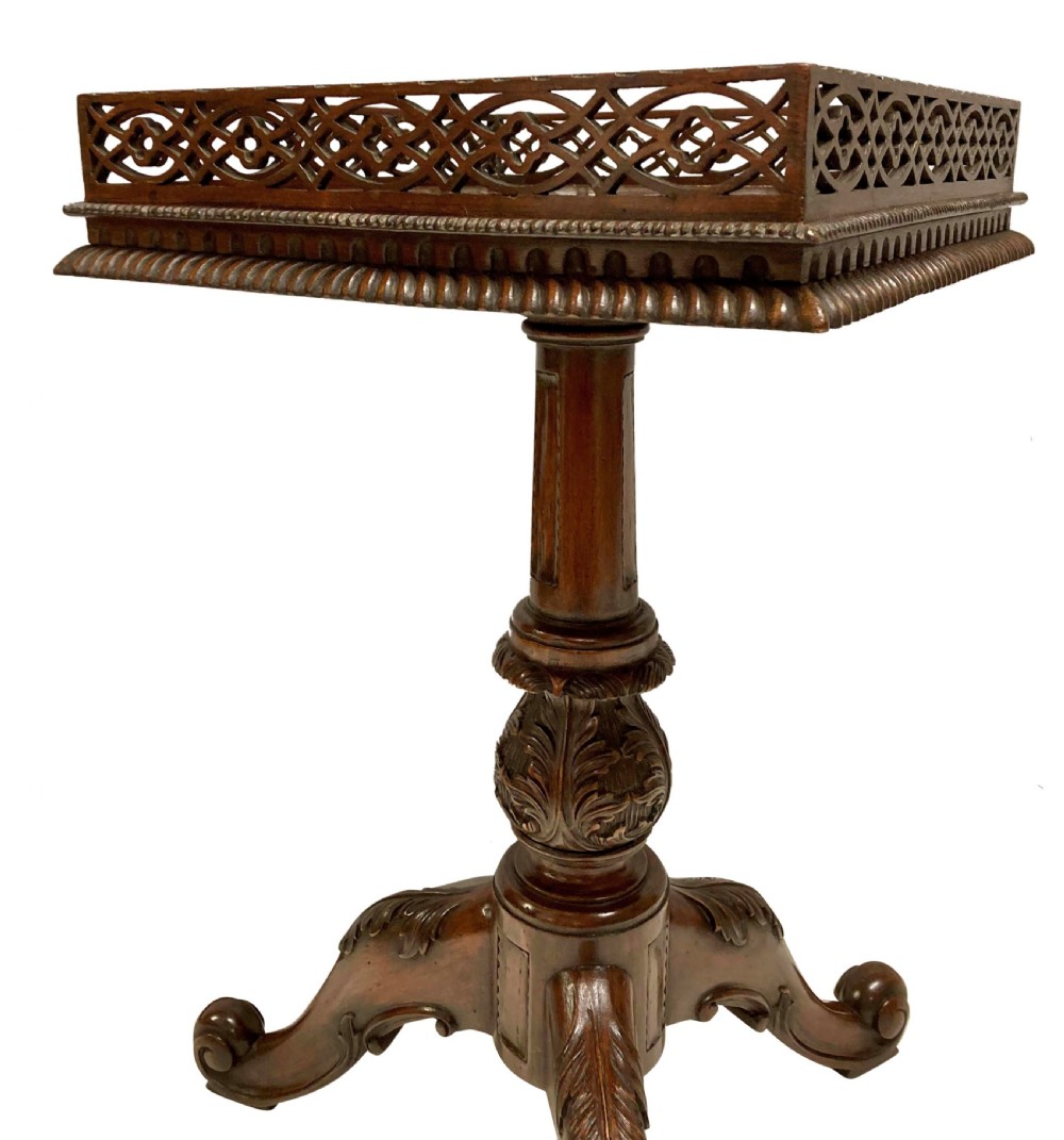 A pair of mahogany wine tables with square pierced fretwork galleries, carved central pedestals, and carved tripod cabriole legs. View IV
