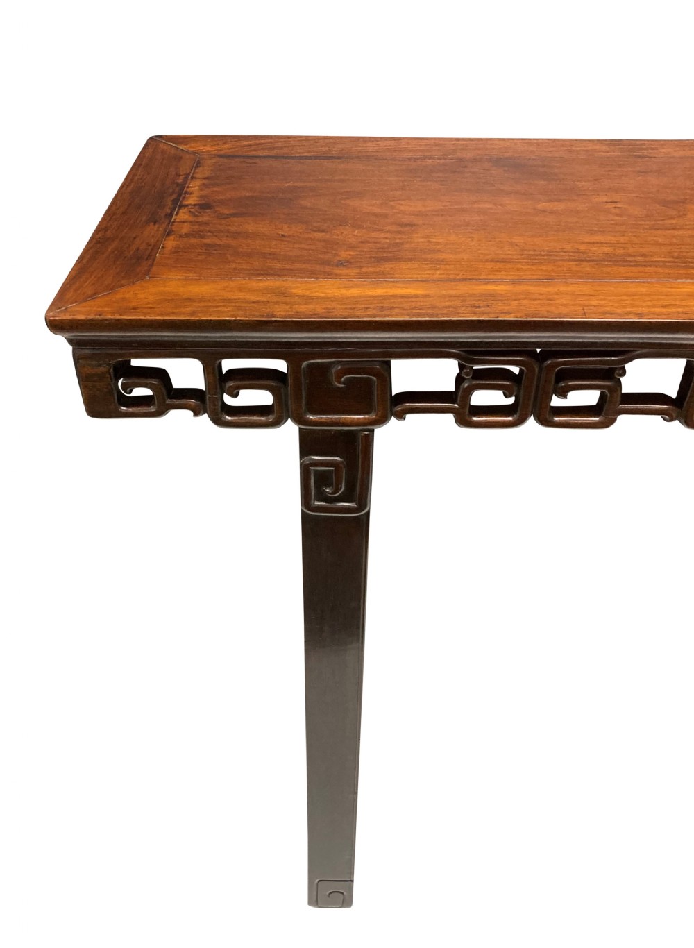 A dark brown Chinese Qing dynasty console table featuring an openwork geometric fretwork apron and curved side stretchers. View IV