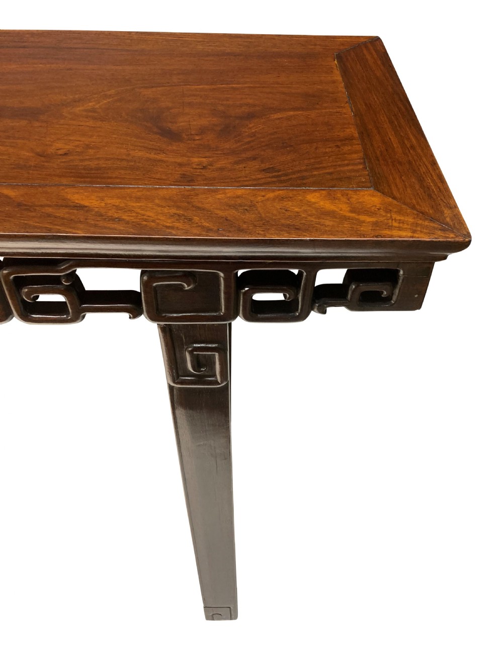 A dark brown Chinese Qing dynasty console table featuring an openwork geometric fretwork apron and curved side stretchers. View IX