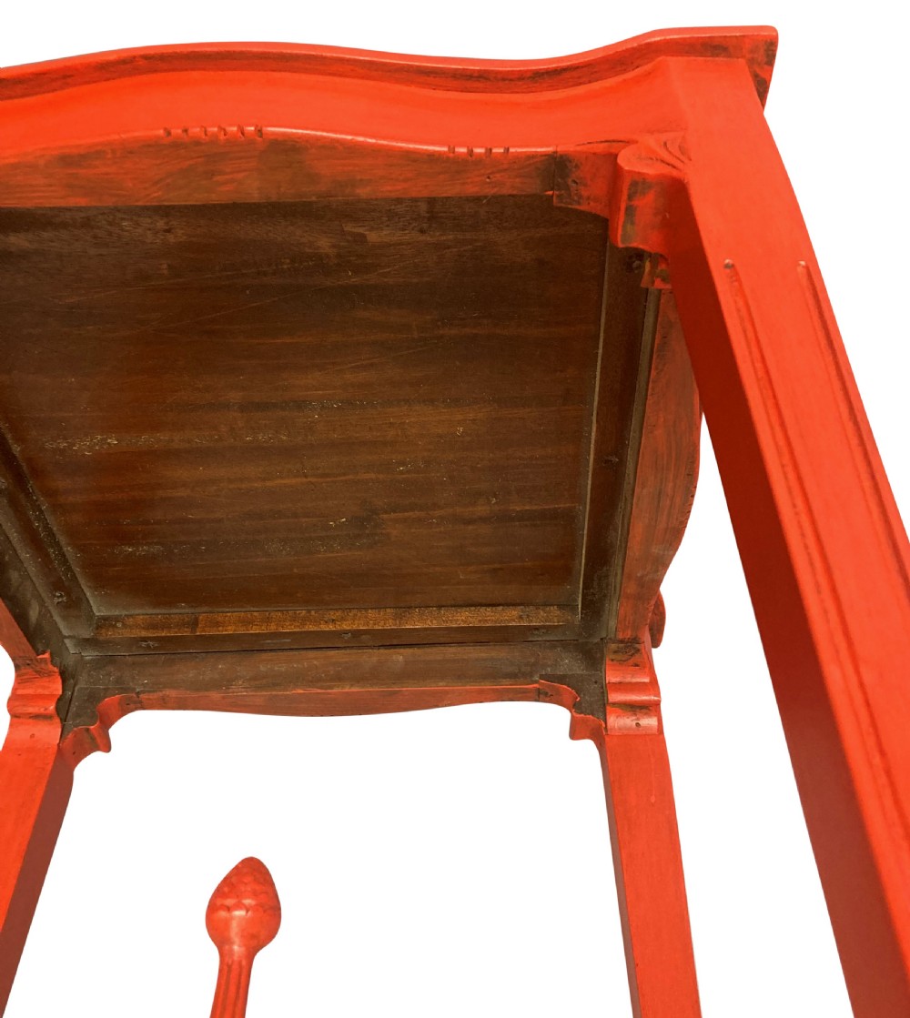 A pair of scarlet red square side tables featuring serpentine tops, carved corner brackets, and intricate pierced X-stretchers with central finials. View IX
