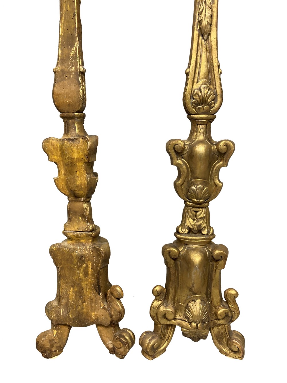 A pair of tall 18th-century Italian carved giltwood table lamps featuring scroll bases, shell carvings, and cream faux candle stems. View III