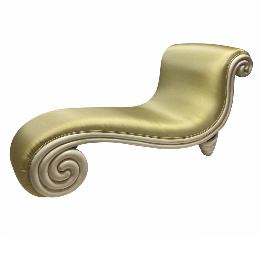 A sculptural Surrealist day bed upholstered in chartreuse satin with an off-white painted scroll-form wooden frame.