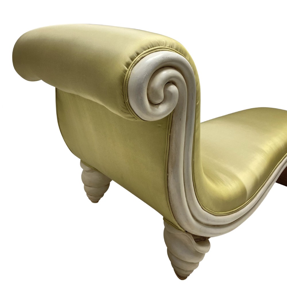 A sculptural Surrealist day bed upholstered in chartreuse satin with an off-white painted scroll-form wooden frame. View VI