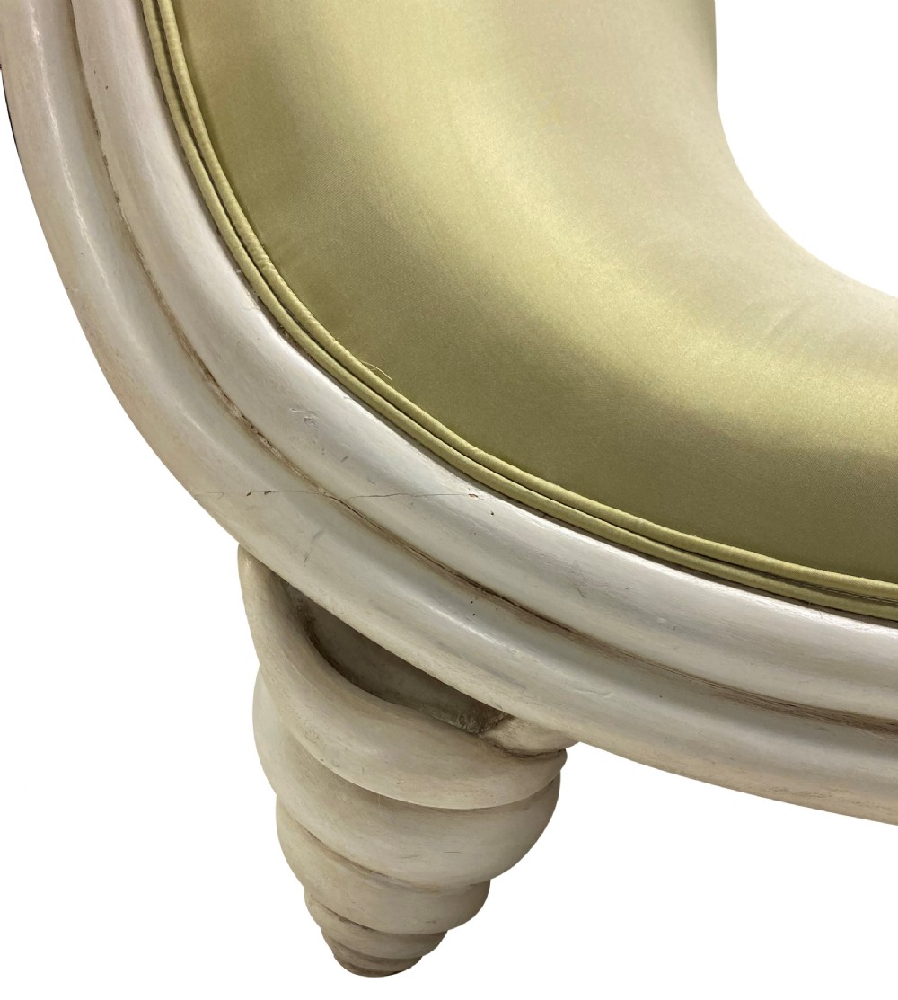 A sculptural Surrealist day bed upholstered in chartreuse satin with an off-white painted scroll-form wooden frame. View VII