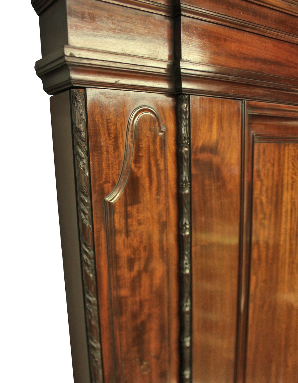 A large dark polished mahogany chimneypiece featuring an integrated panelled overmantel and architectural stepped mouldings. View IV