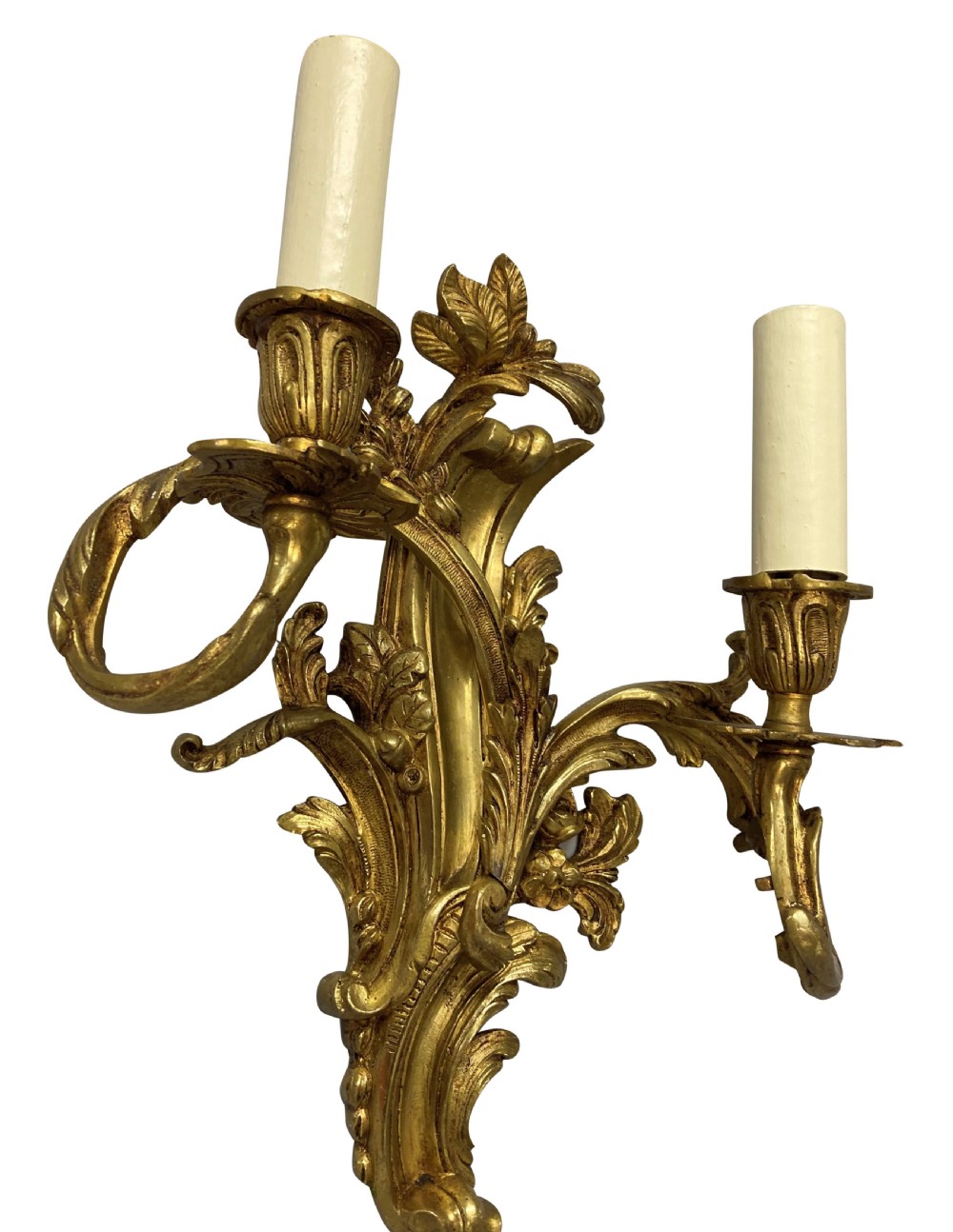 A pair of French Louis XV style gilt bronze two-light wall sconces featuring ornate asymmetrical acanthus foliage and candle holders. View V