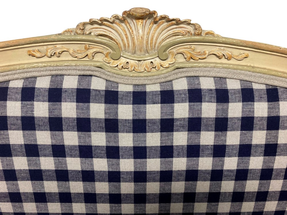 A painted Louis XV style upholstered canape with curved cabriole legs and a navy and cream gingham patterned fabric. View V