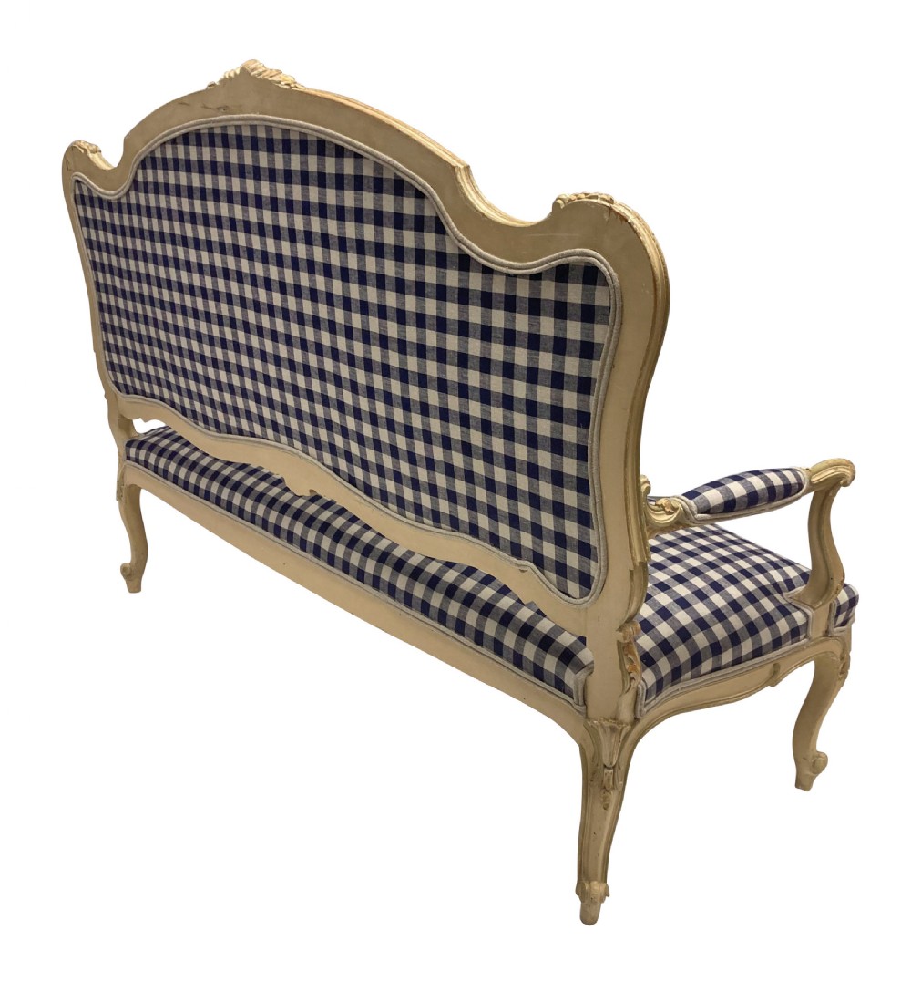 A painted Louis XV style upholstered canape with curved cabriole legs and a navy and cream gingham patterned fabric. View VI