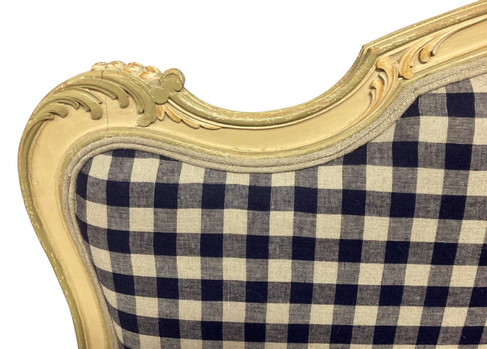 A painted Louis XV style upholstered canape with curved cabriole legs and a navy and cream gingham patterned fabric. View VII