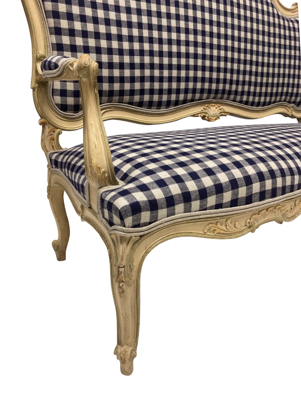 A painted Louis XV style upholstered canape with curved cabriole legs and a navy and cream gingham patterned fabric. View VIII