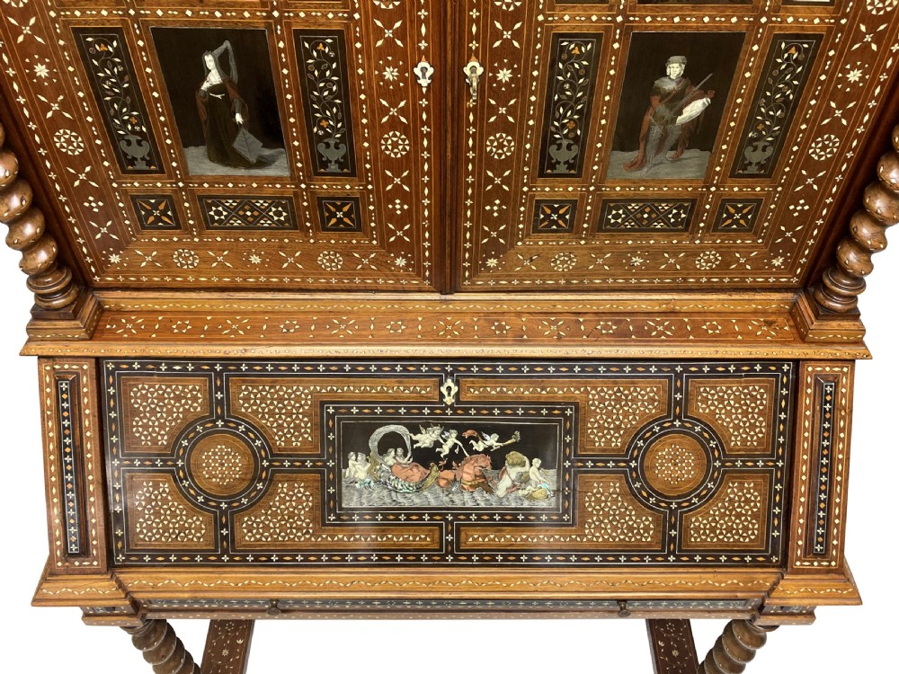 An ornate 19th-century Moorish Revival walnut cabinet secretaire on stand featuring intricate bone inlay and barley-twist legs. View VI