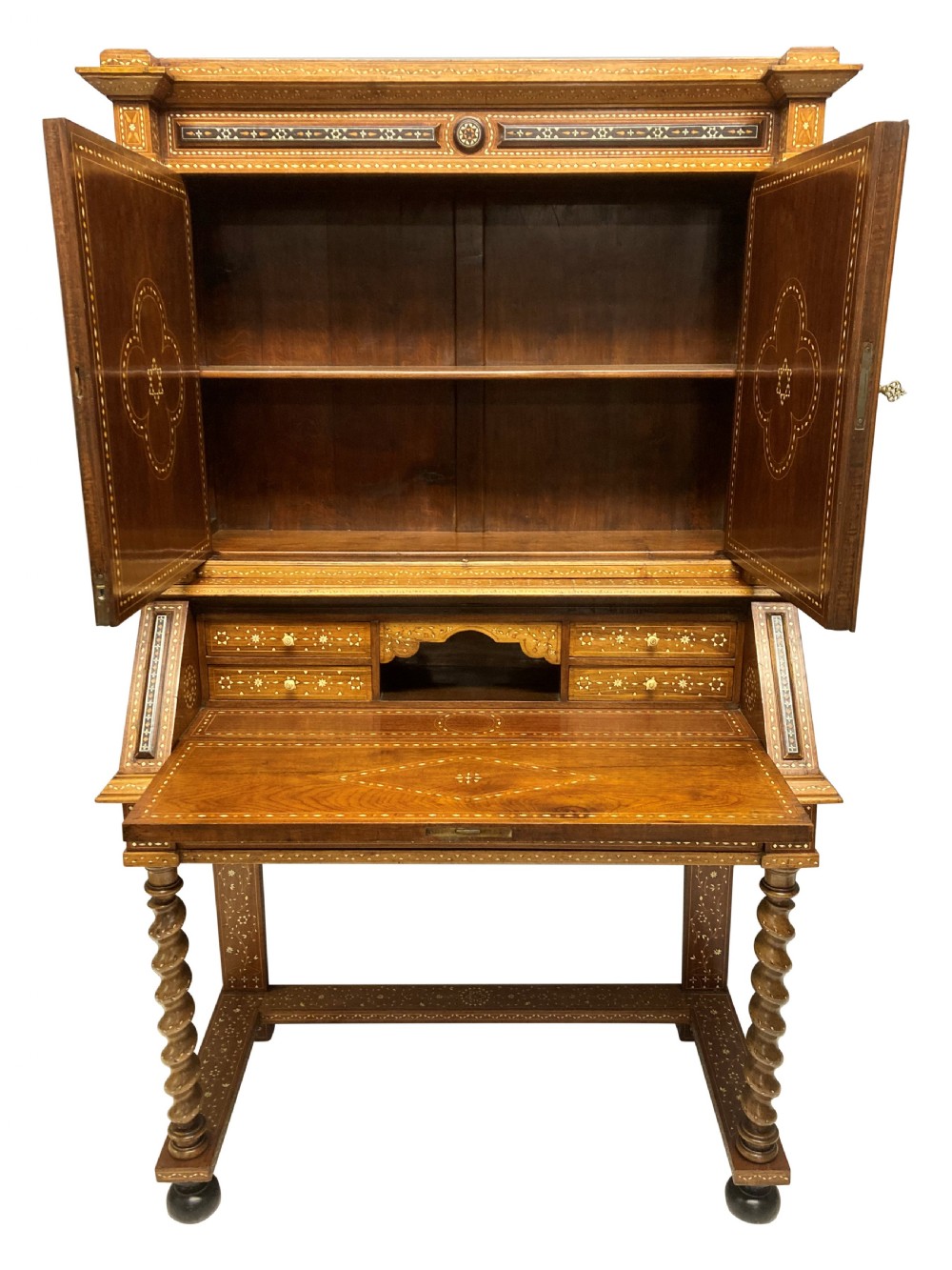 An ornate 19th-century Moorish Revival walnut cabinet secretaire on stand featuring intricate bone inlay and barley-twist legs. View VII