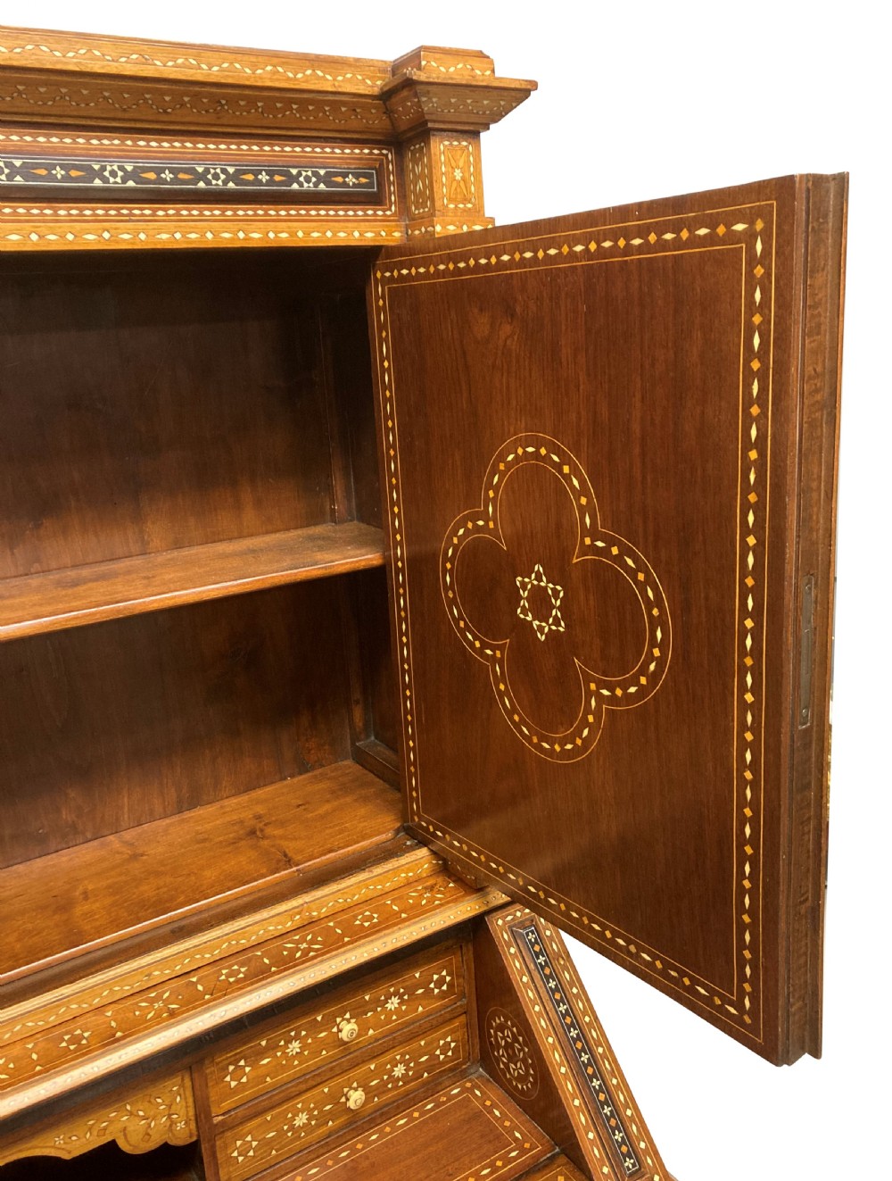 An ornate 19th-century Moorish Revival walnut cabinet secretaire on stand featuring intricate bone inlay and barley-twist legs. View VIII