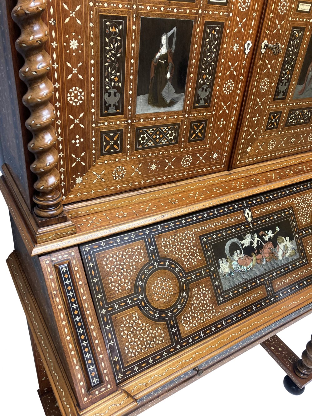 An ornate 19th-century Moorish Revival walnut cabinet secretaire on stand featuring intricate bone inlay and barley-twist legs. View IX