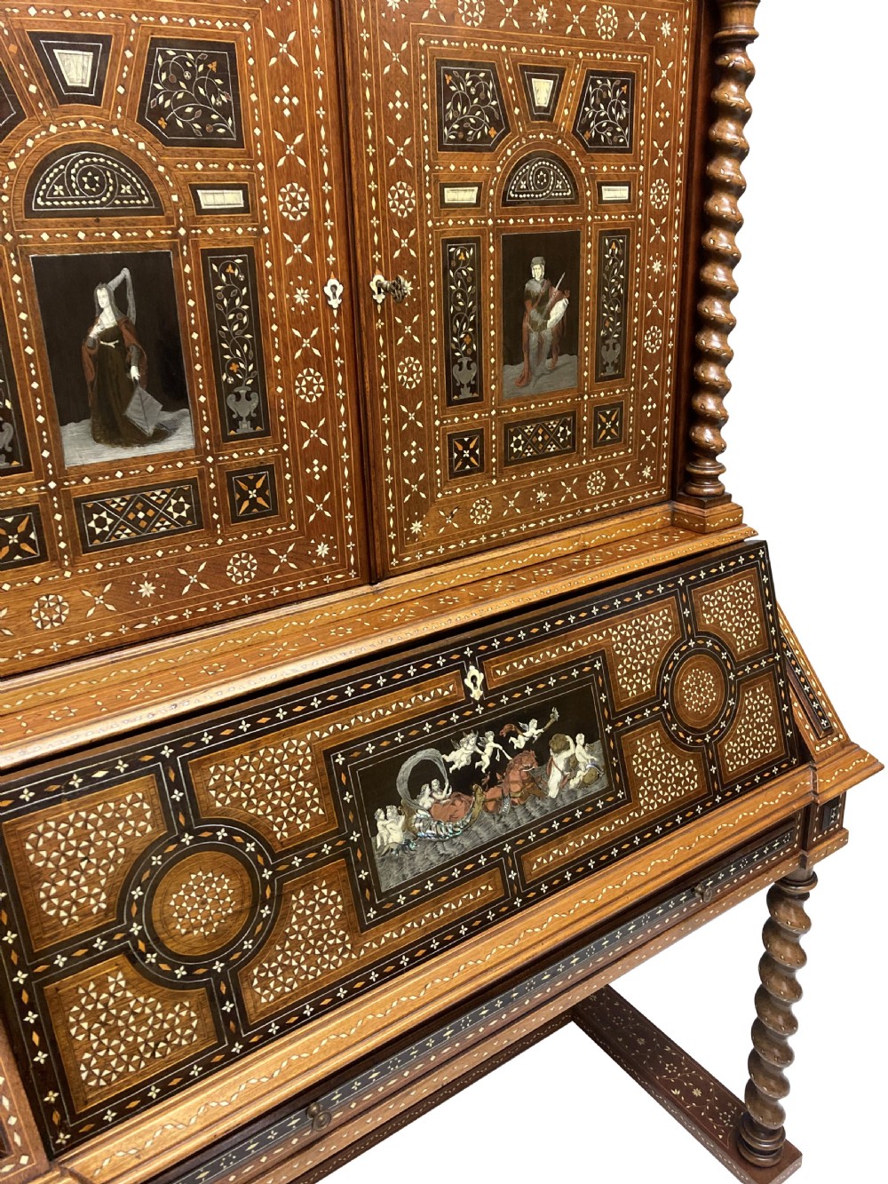 An ornate 19th-century Moorish Revival walnut cabinet secretaire on stand featuring intricate bone inlay and barley-twist legs. View XIII
