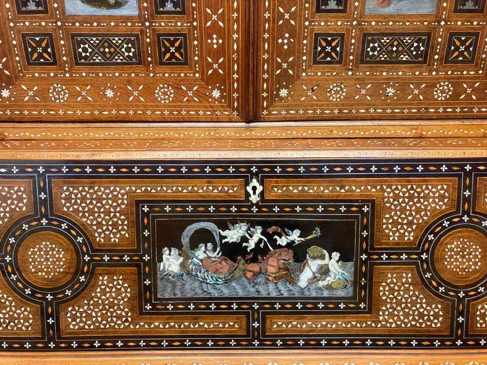 An ornate 19th-century Moorish Revival walnut cabinet secretaire on stand featuring intricate bone inlay and barley-twist legs. View XIV