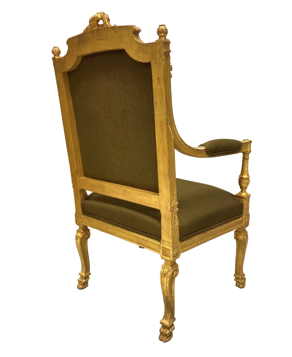 A Louis XIV style giltwood armchair featuring a gold leaf carved frame, turned arm supports, and dark olive green fabric upholstery. View VIII