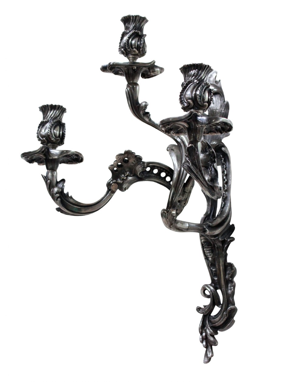A pair of three-light silver-plated wall sconces with ornate Rococo scrolling branches and leaf ornamentation. View III