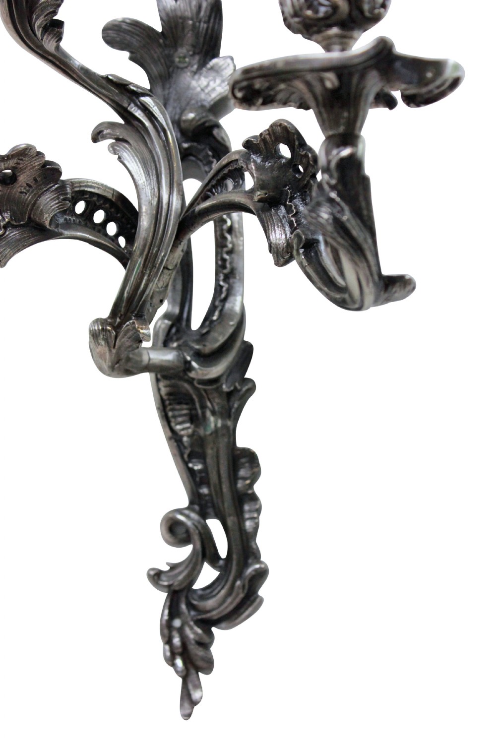 A pair of three-light silver-plated wall sconces with ornate Rococo scrolling branches and leaf ornamentation. View IV