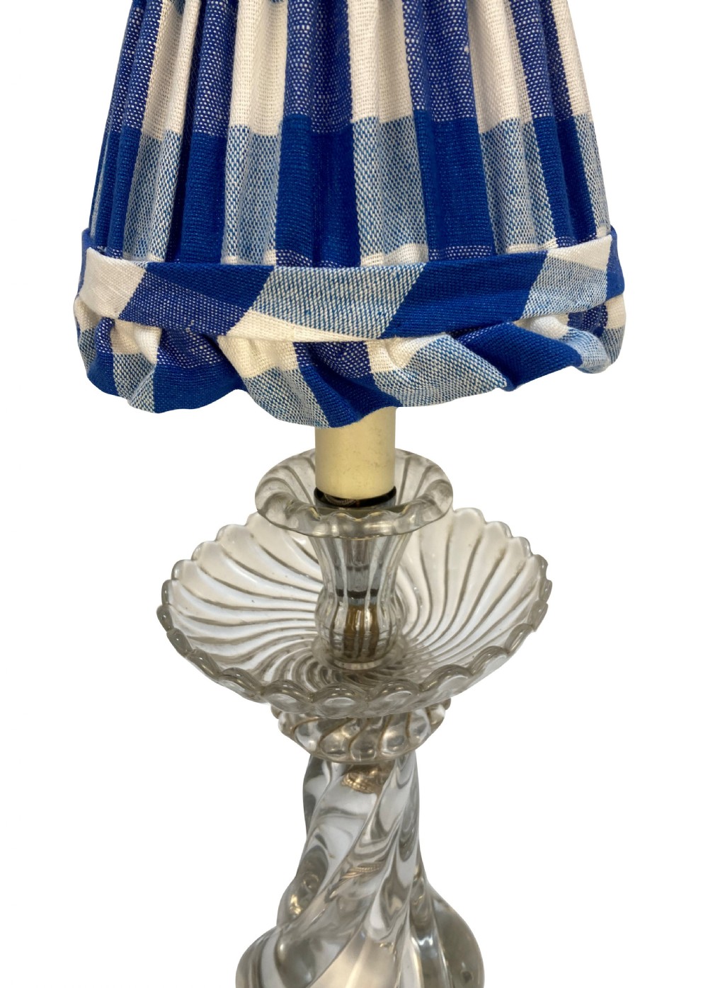 A 1930s French table lamp featuring a twisted moulded clear glass stem with a scalloped dish detail, topped with a blue and white gingham pleated lampshade. View II