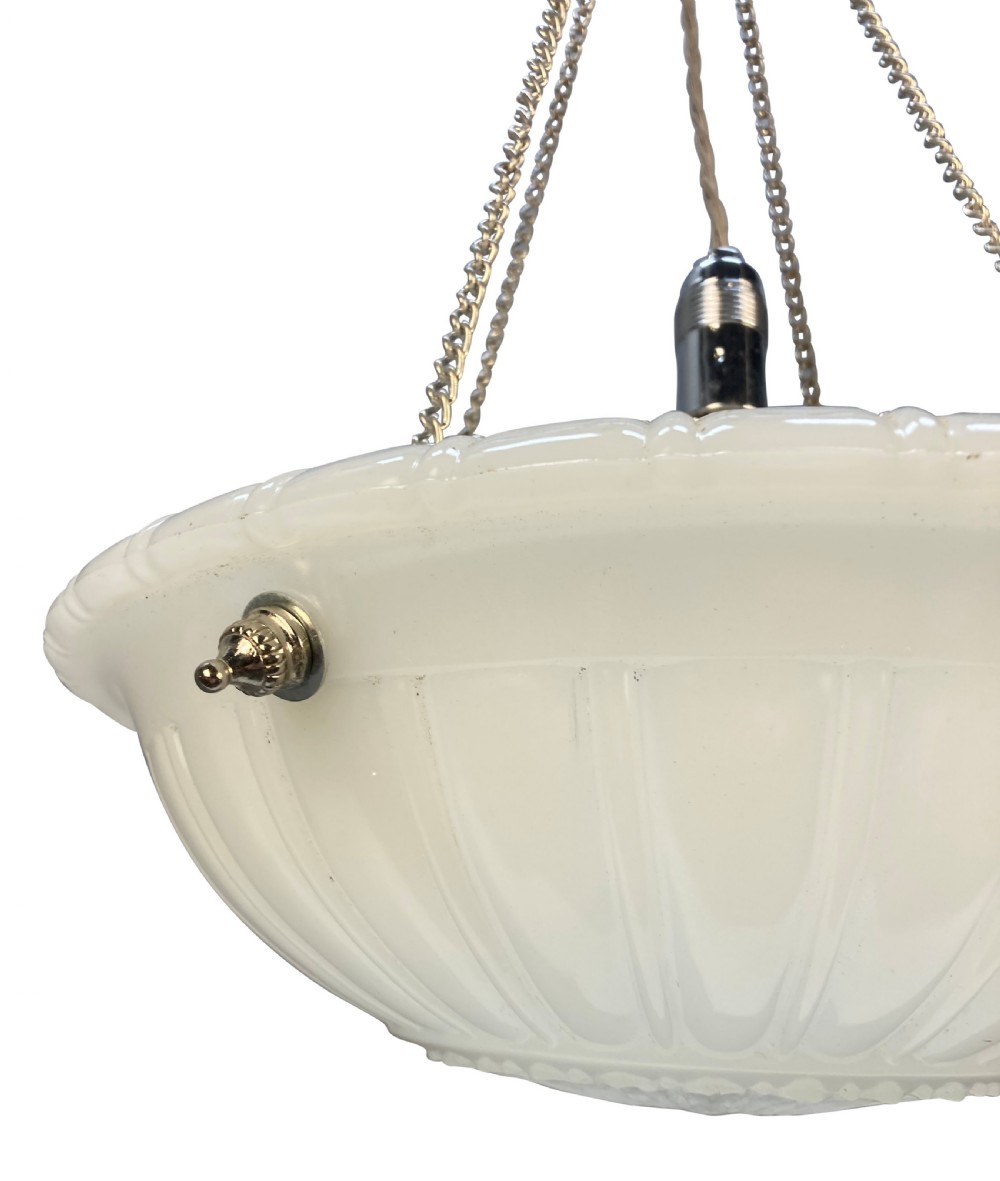 A translucent off-white carved alabaster dish ceiling light suspended by three brass link chains from a central ceiling rose. View II