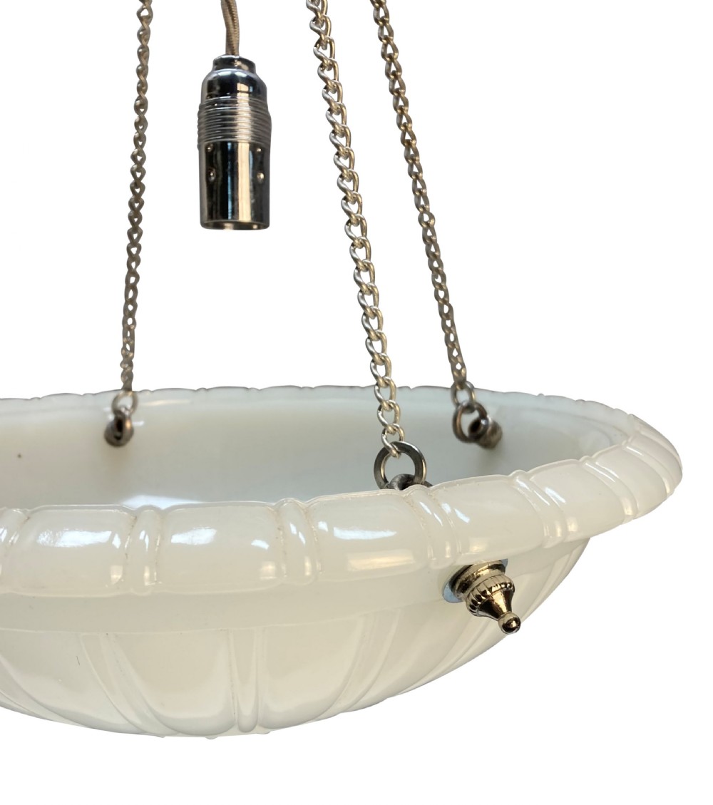 A translucent off-white carved alabaster dish ceiling light suspended by three brass link chains from a central ceiling rose. View IV