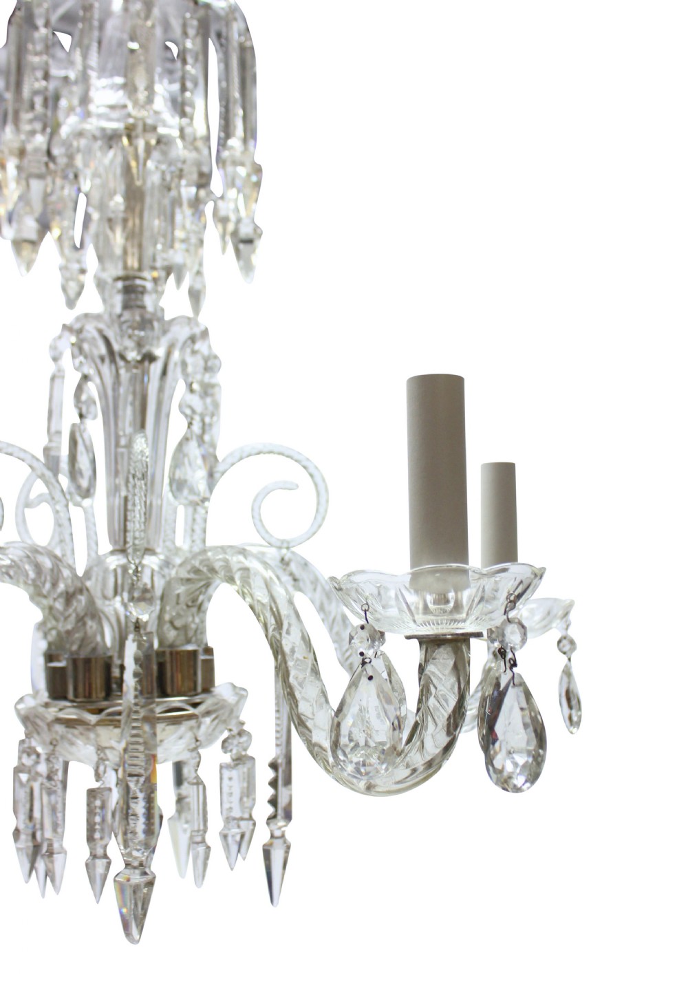 A small clear cut glass chandelier featuring curved glass arms, candle sockets, and faceted crystal drops. View IV