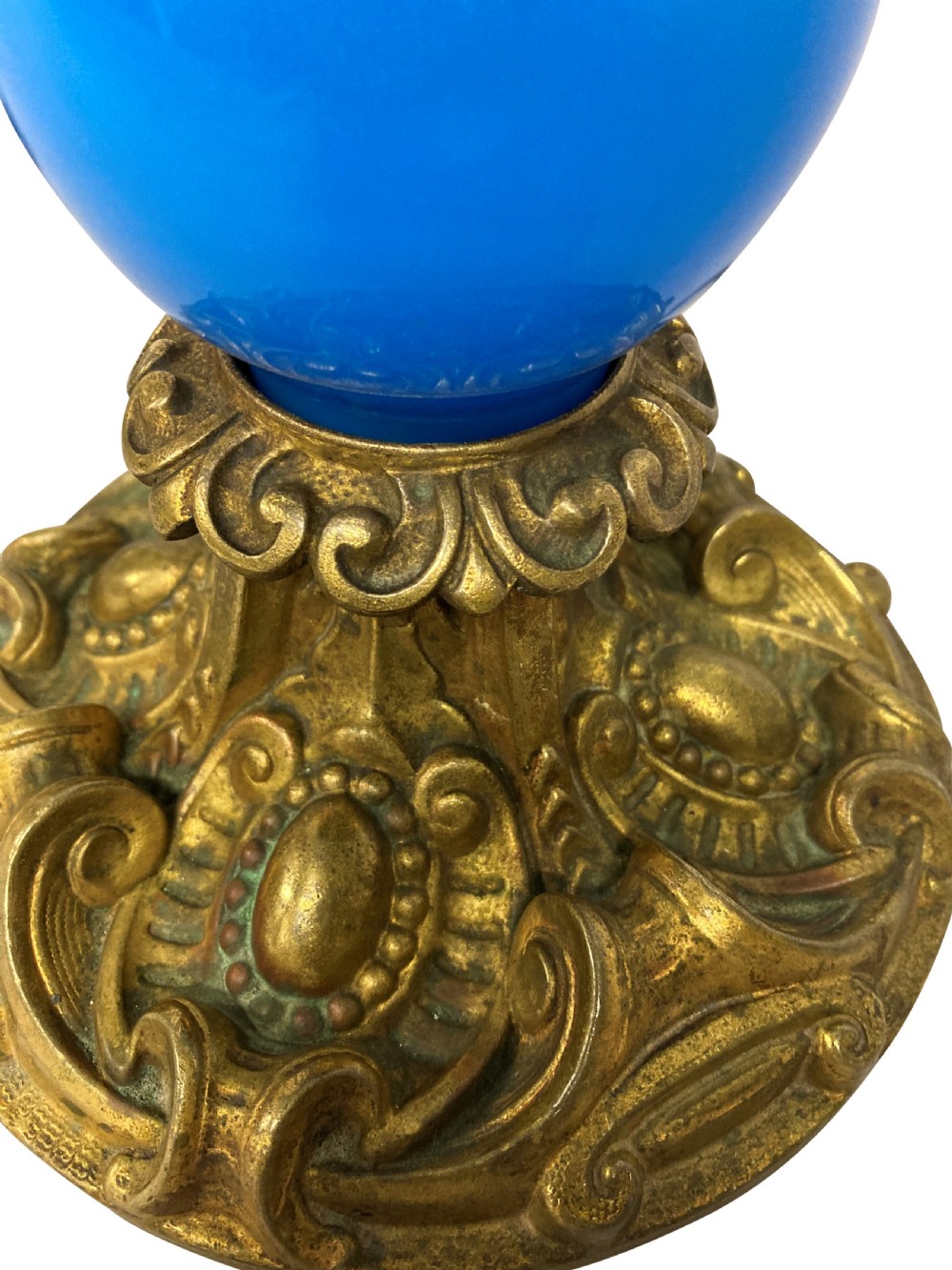 A late 19th-century French table lamp featuring a vibrant blue glass body mounted on a ornate gilt bronze scroll base. View II