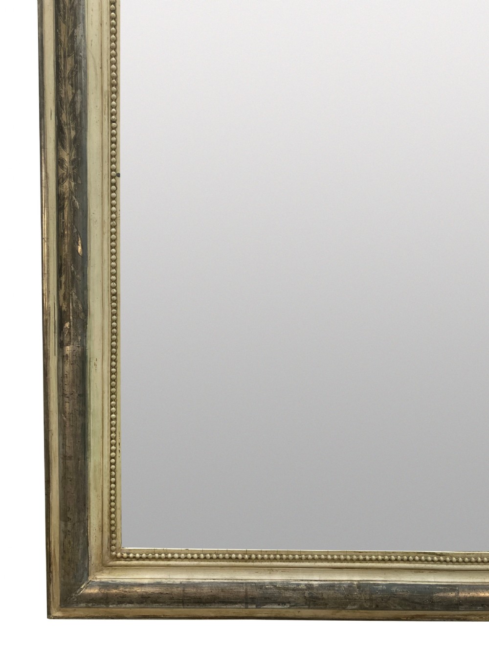 An antique French silver leaf overmantel mirror featuring rounded top corners, a beaded inner rim, and subtle etched leaf motifs on the frame. View II