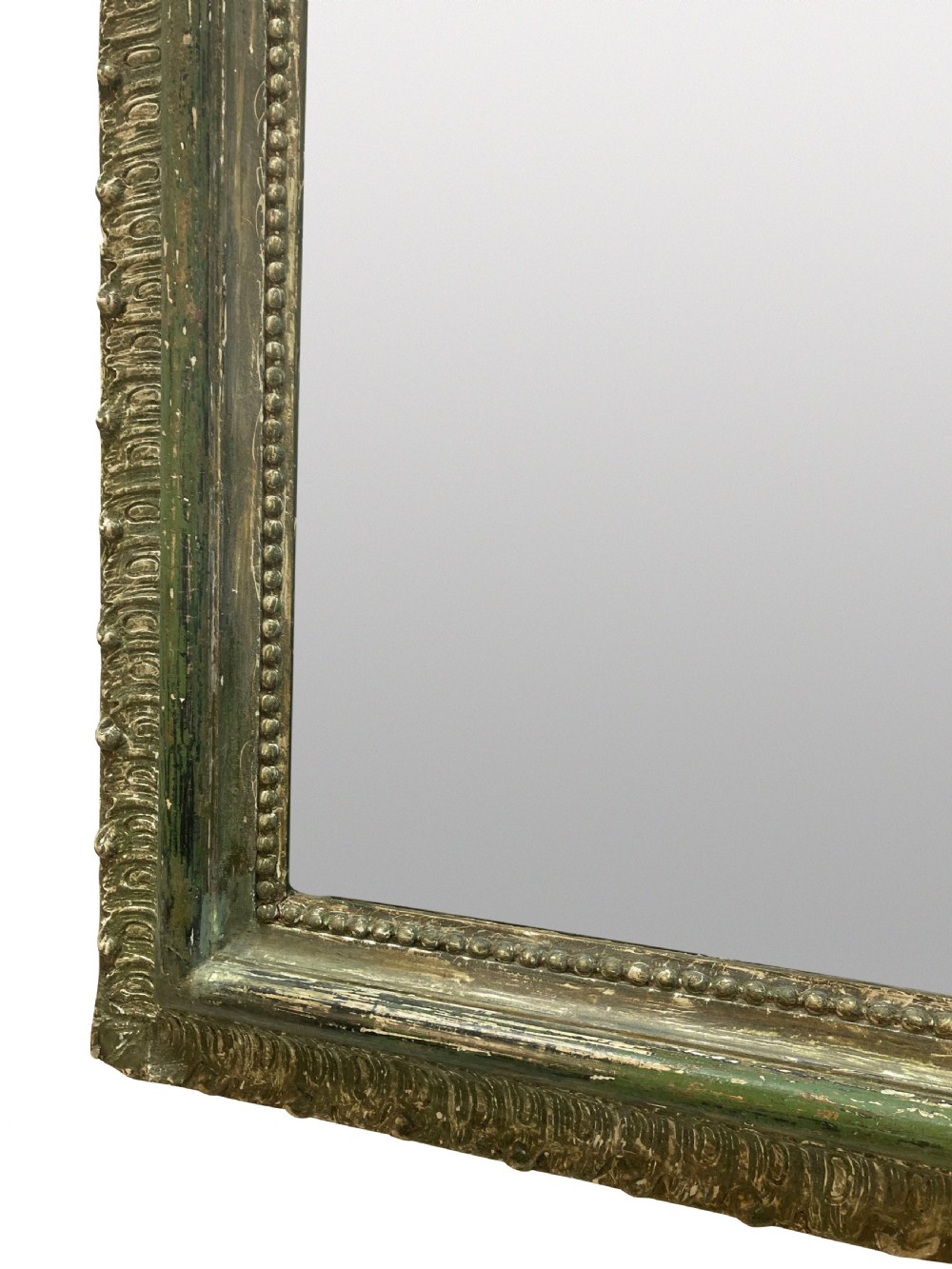 An arched Louis XV style rectangular overmantel mirror featuring a carved ornate scroll crest and a weathered green and gilded frame. View IV