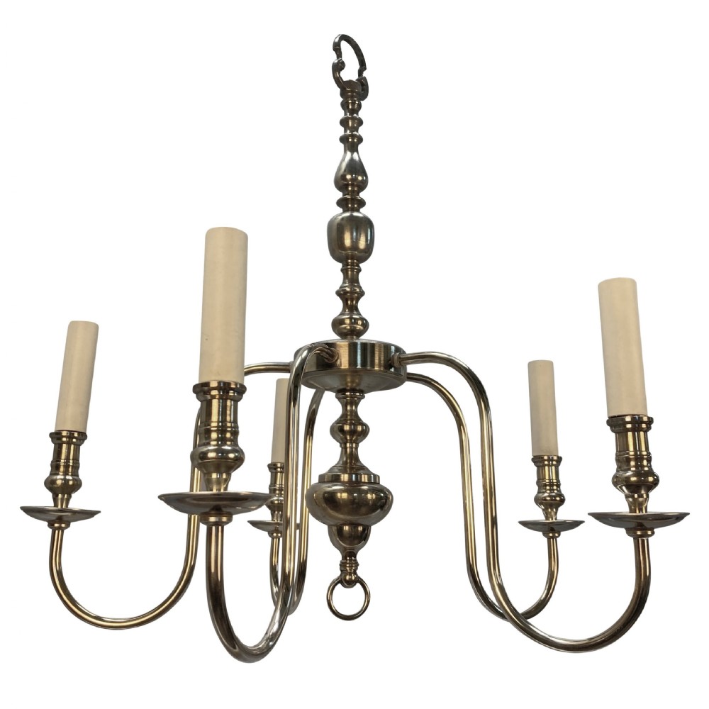 An Edwardian silver-plated five-arm chandelier featuring a turned central baluster column, sweeping curved arms, and candle sleeves. View II