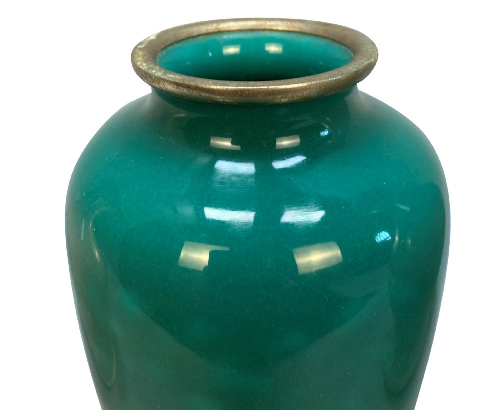 A trio of Japanese ceramic vases featuring a cream crackle-glazed vase, a small turquoise enamel vase with metal mounts, and a tall pale green celadon vase with carved lotus motifs. View III