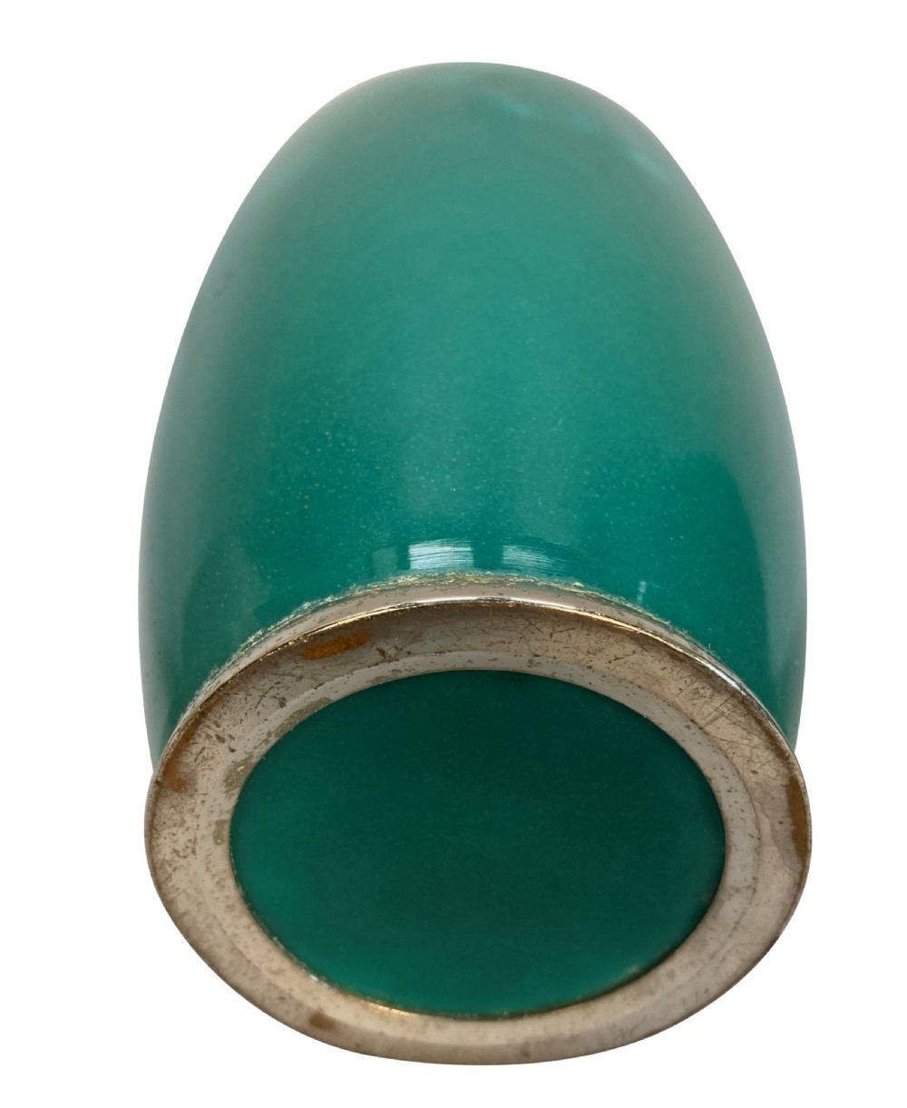 A trio of Japanese ceramic vases featuring a cream crackle-glazed vase, a small turquoise enamel vase with metal mounts, and a tall pale green celadon vase with carved lotus motifs. View IV
