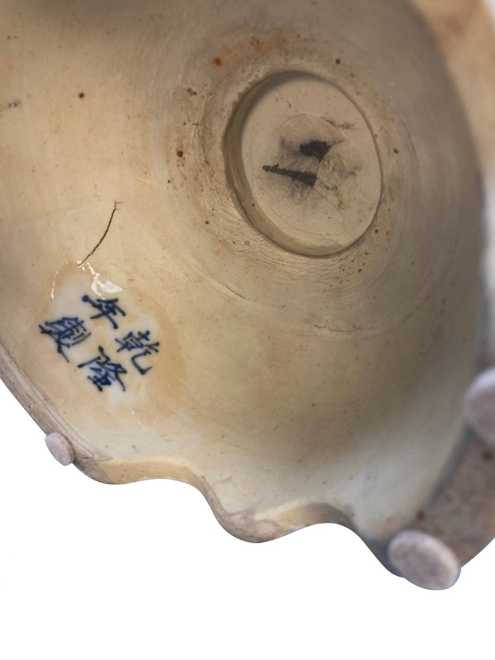 A blue and white Chinese porcelain tulipiere featuring floral and dragon underglaze motifs with multiple spout apertures surrounding a central finial. View VIII
